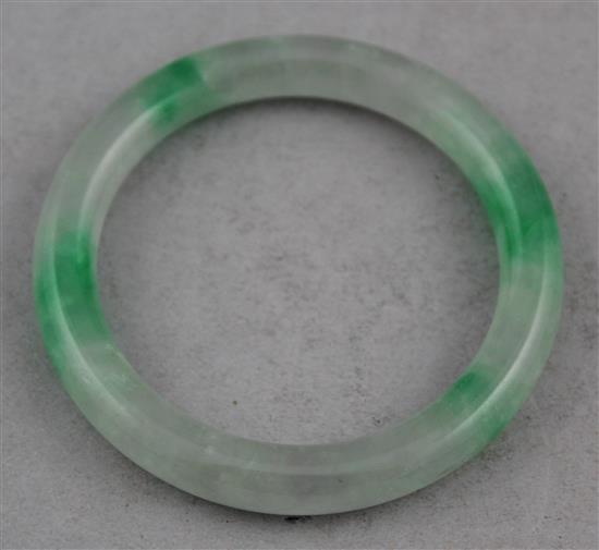 A Chinese ice white and emerald green jadeite bangle, 7.4cm.